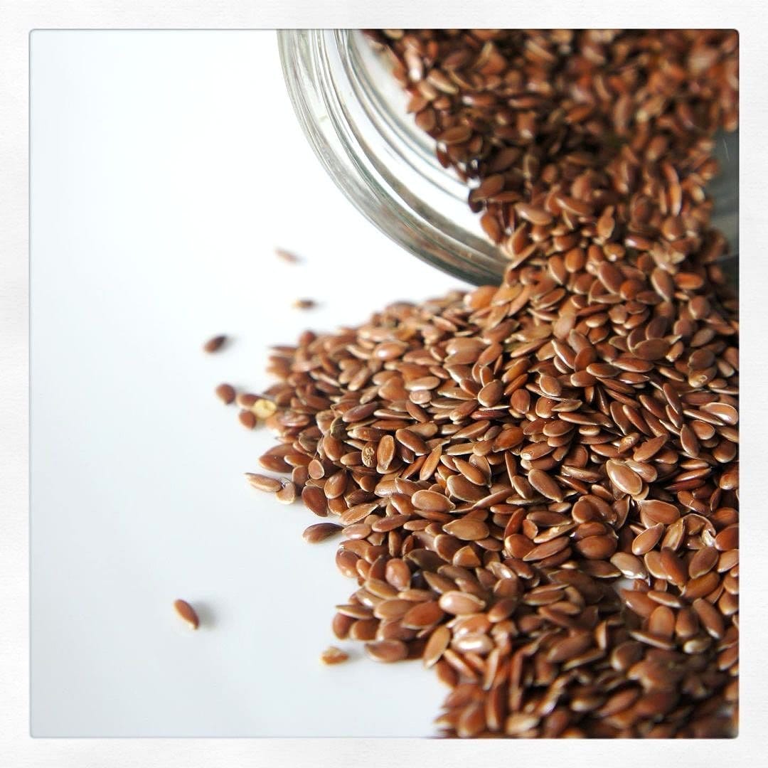 flaxseeds in wooden bowl