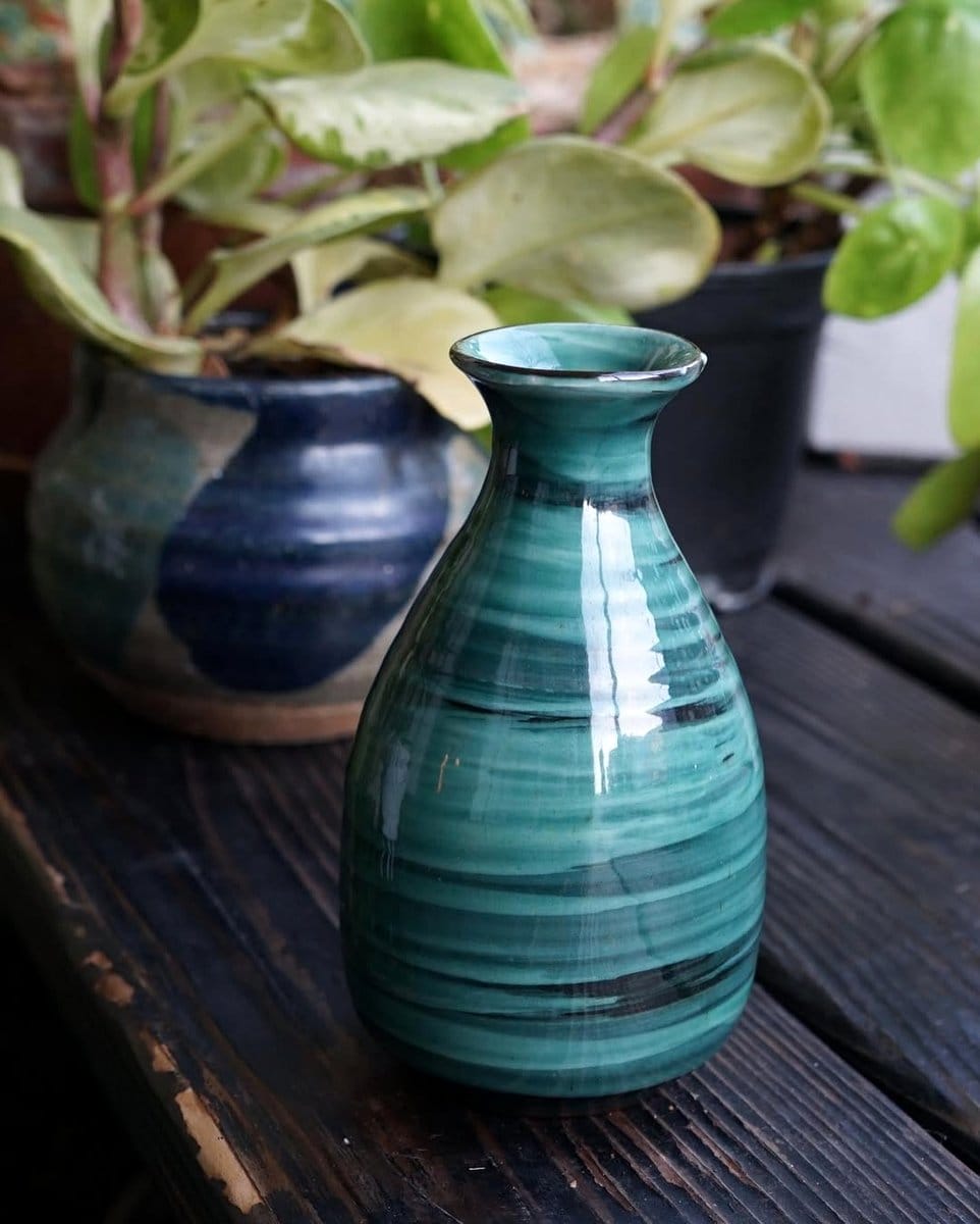 tarragon plant in blue ceramic pot