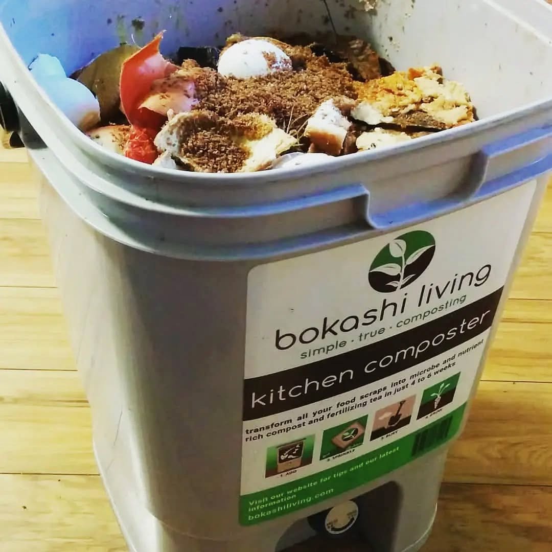 bokashi bin with kitchen scraps