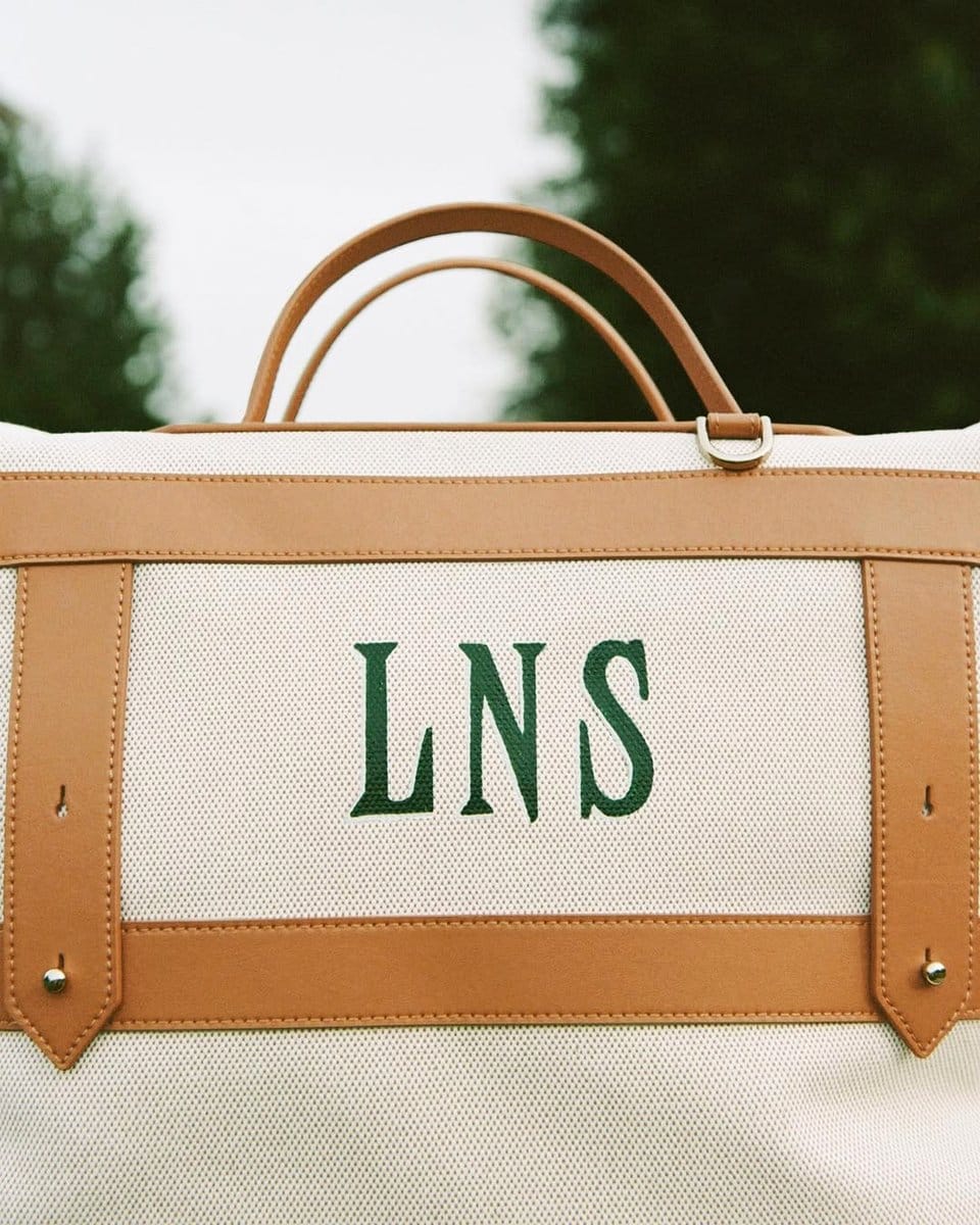 monogrammed suitcase with indoor plants