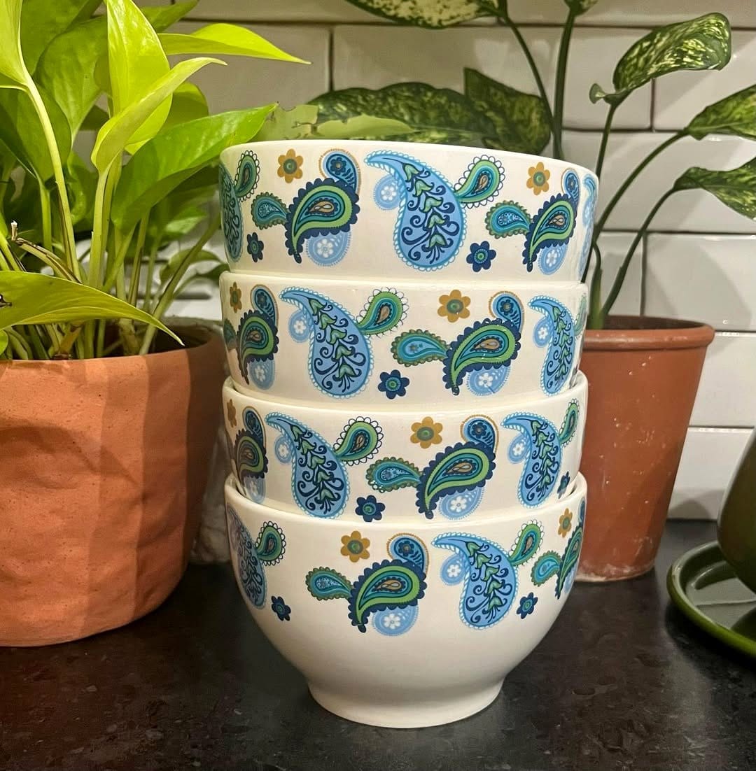 Retro-style quilted plant pot cover with vintage prints