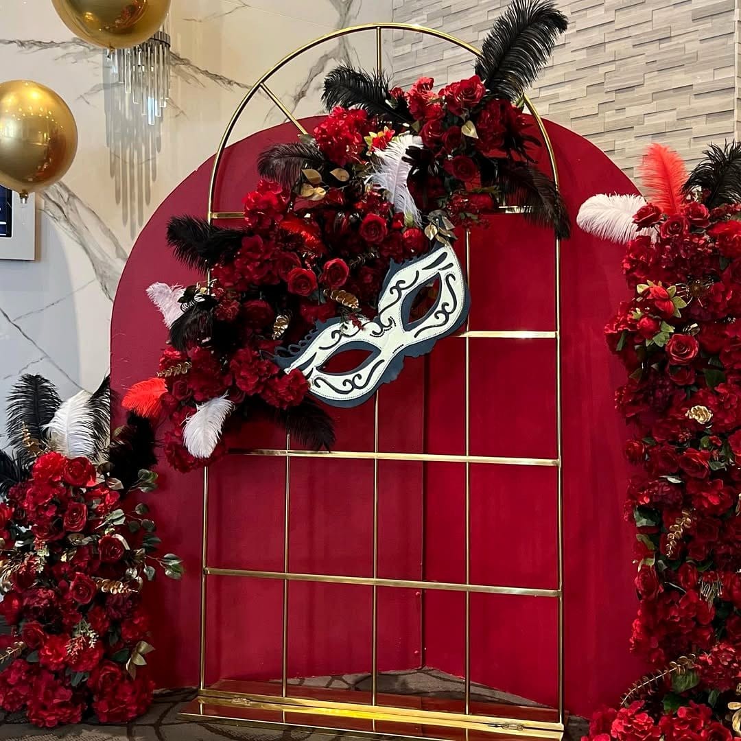 Venetian masquerade mask with lush Boston fern backdrop