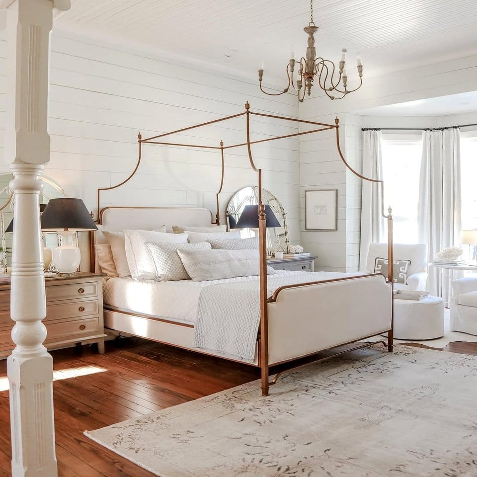 Velvet canopy bed with hanging greenery