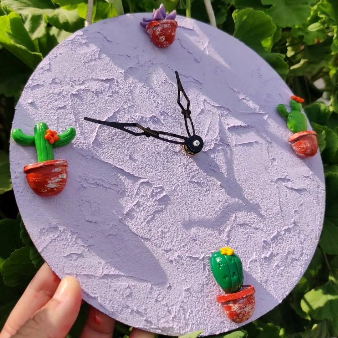 Clock with shell and succulent embellishments