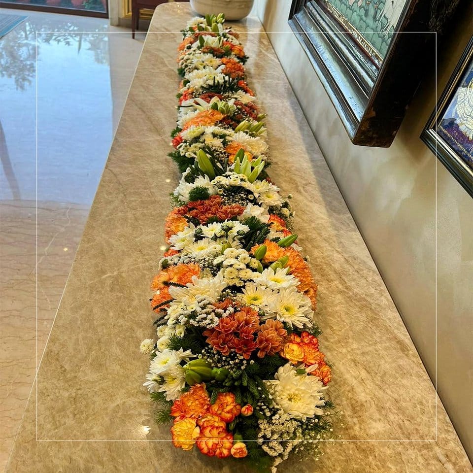 Floral arrangement on rune plant stand