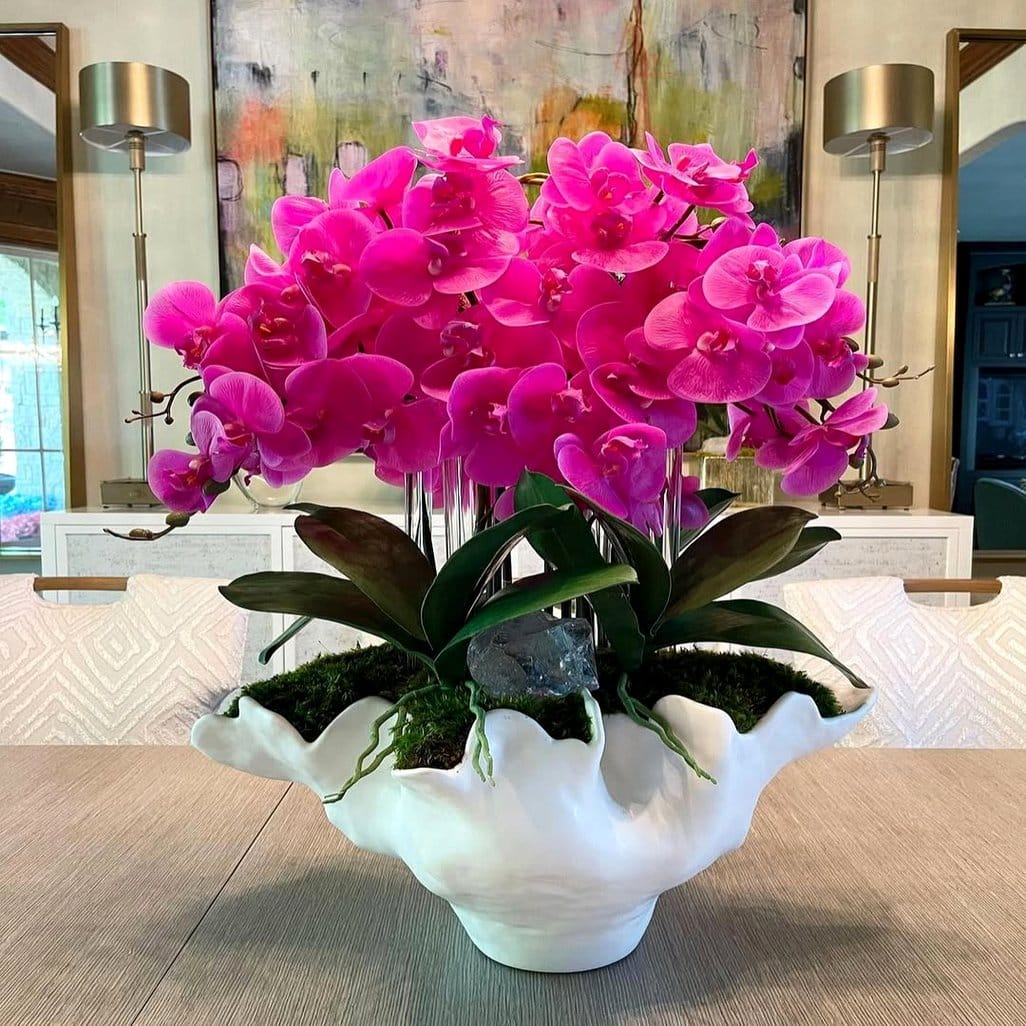 Elegant pearl and plant centerpiece with orchids