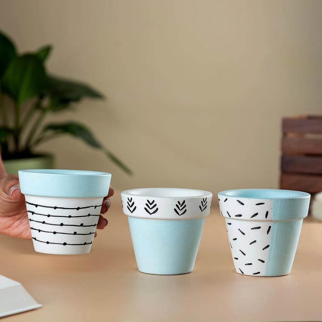 Vintage-style folk art painted plant pot