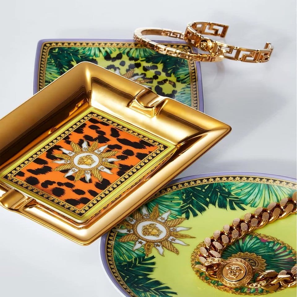 Stylish jungle-themed tableware set on dining table