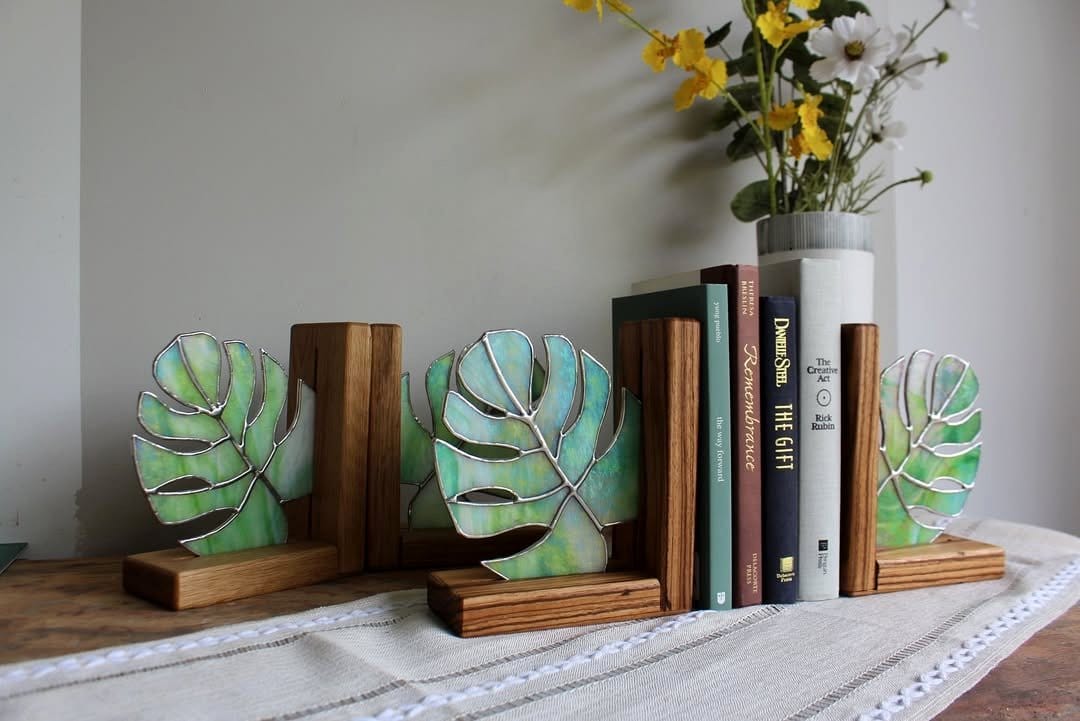 Stylish glowing moss bookends on shelf