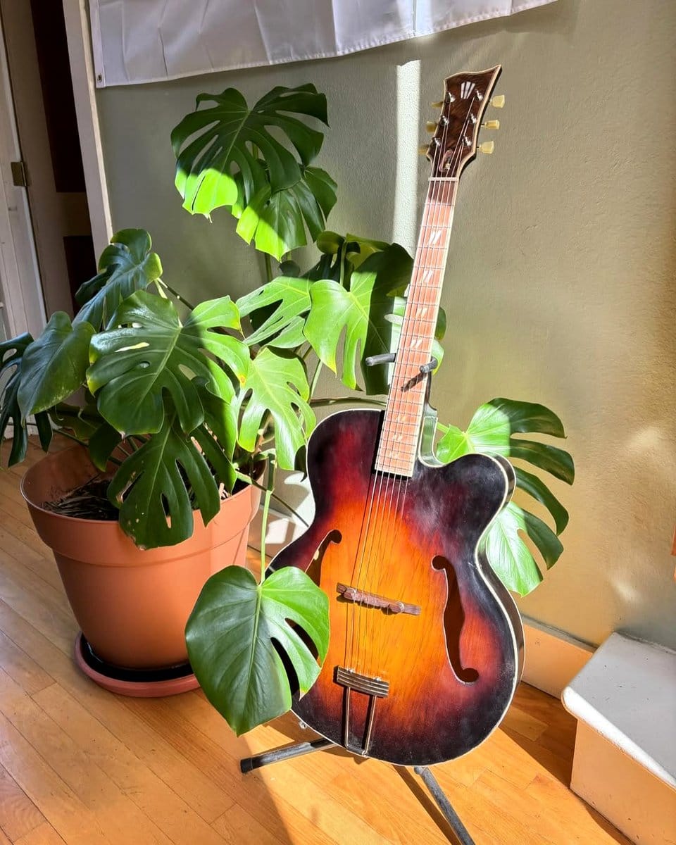 acoustic guitar on a wooden table
