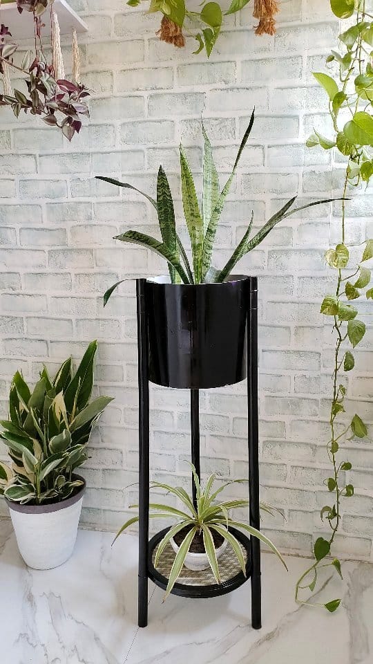 Galvanized metal buckets on a wooden shelf