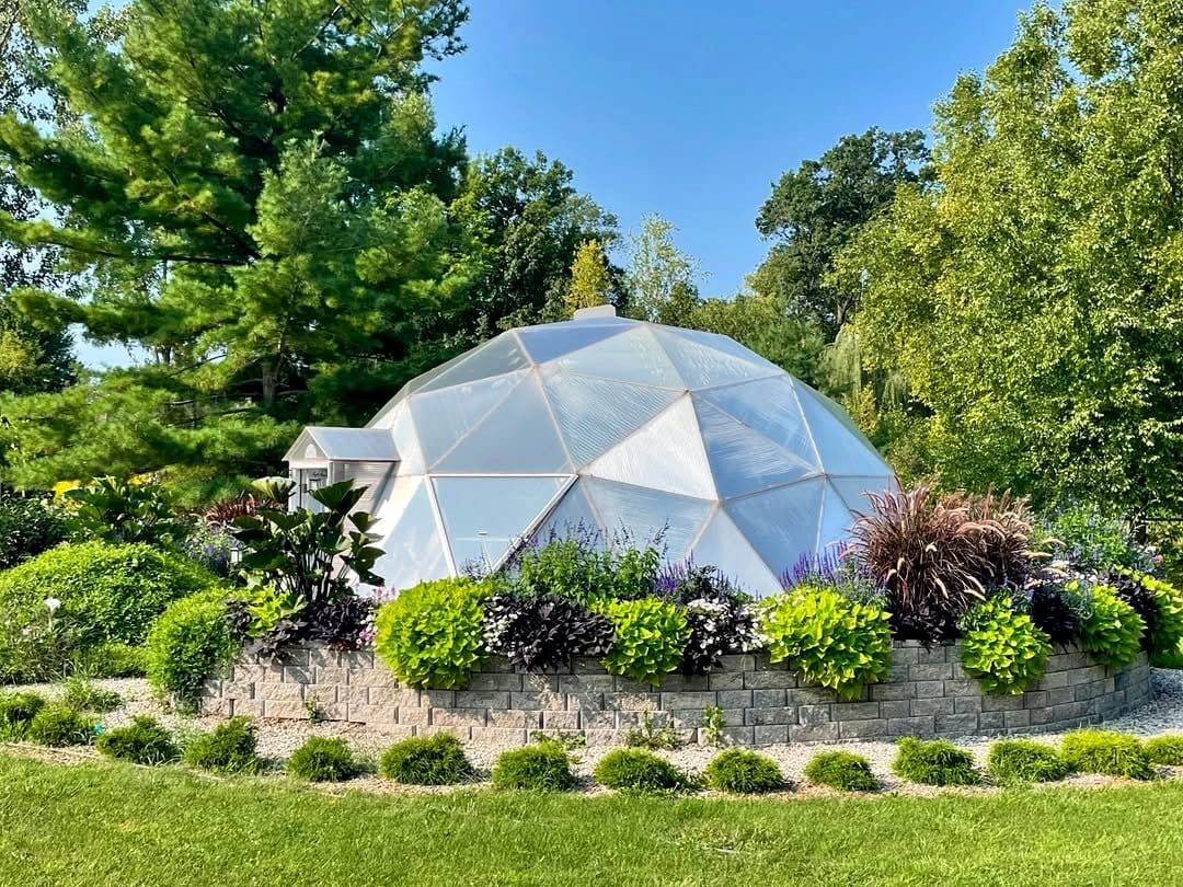 small dome greenhouse in garden