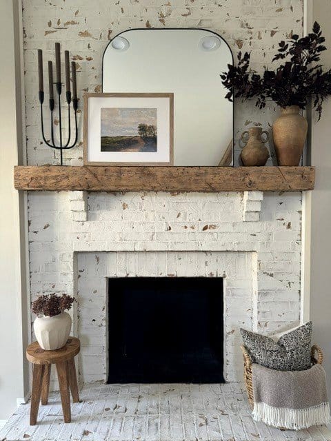 Wooden fireplace mantel with rustic decor