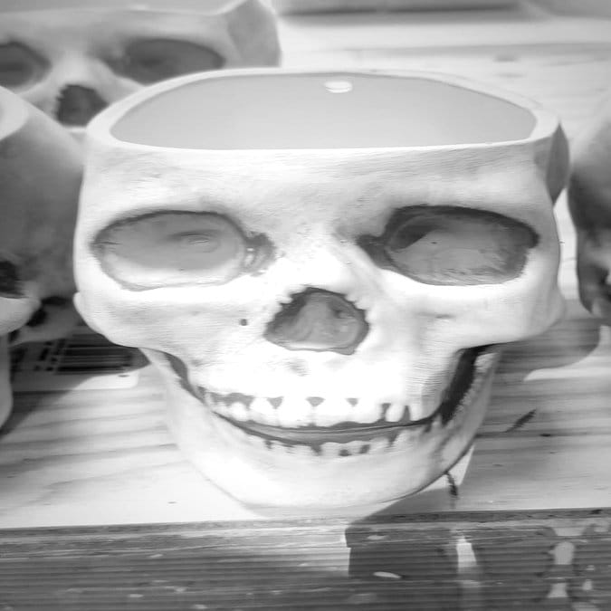 Brightly painted ceramic skull planters