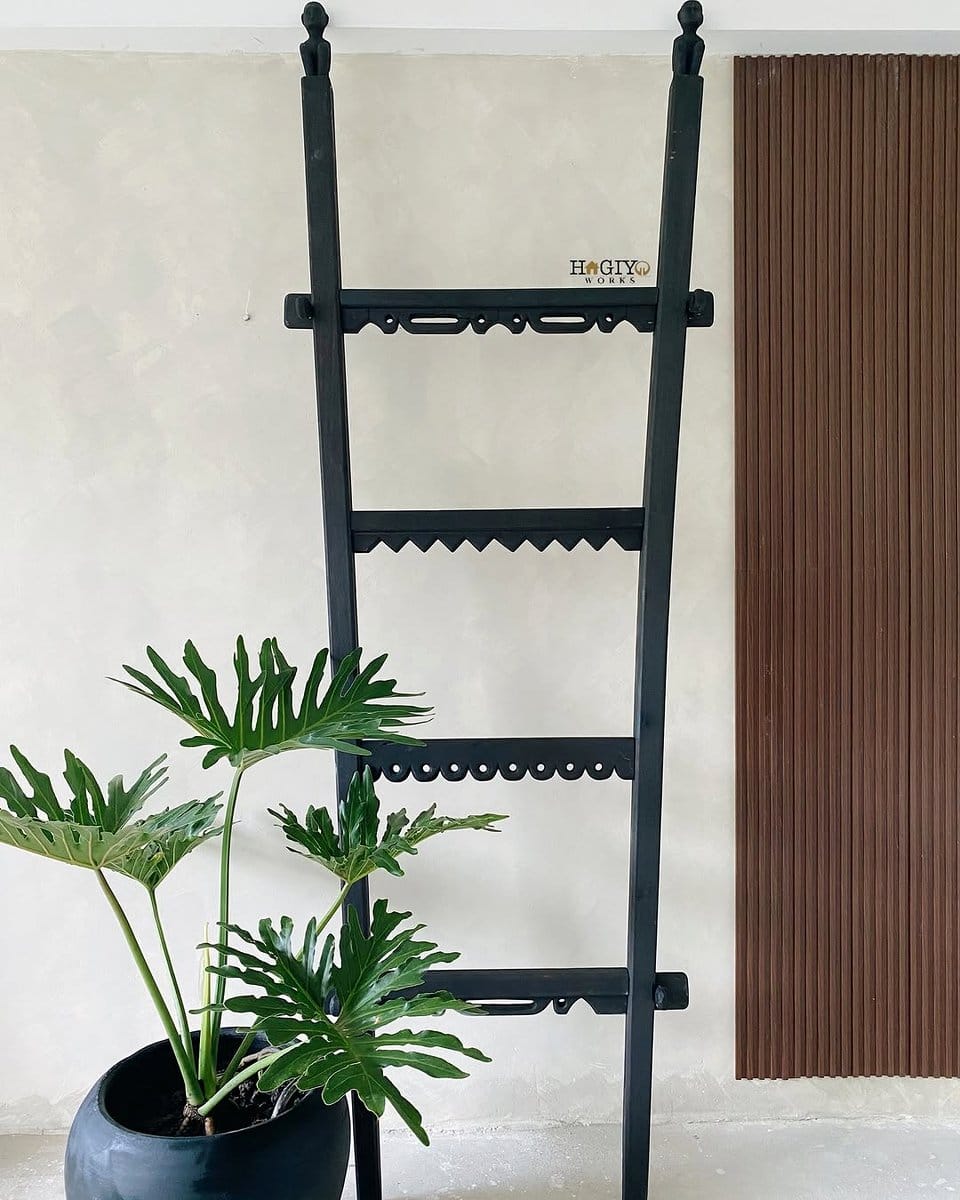 leaning ladder with potted plants