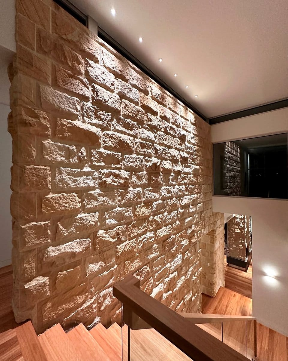 art gallery wall with focused uplighting