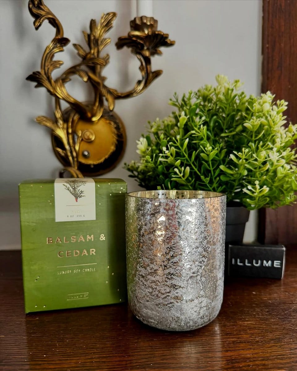 scented candles beside potted plants