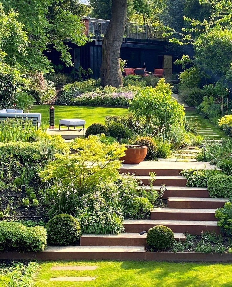 under-stairs plant nook with ferns