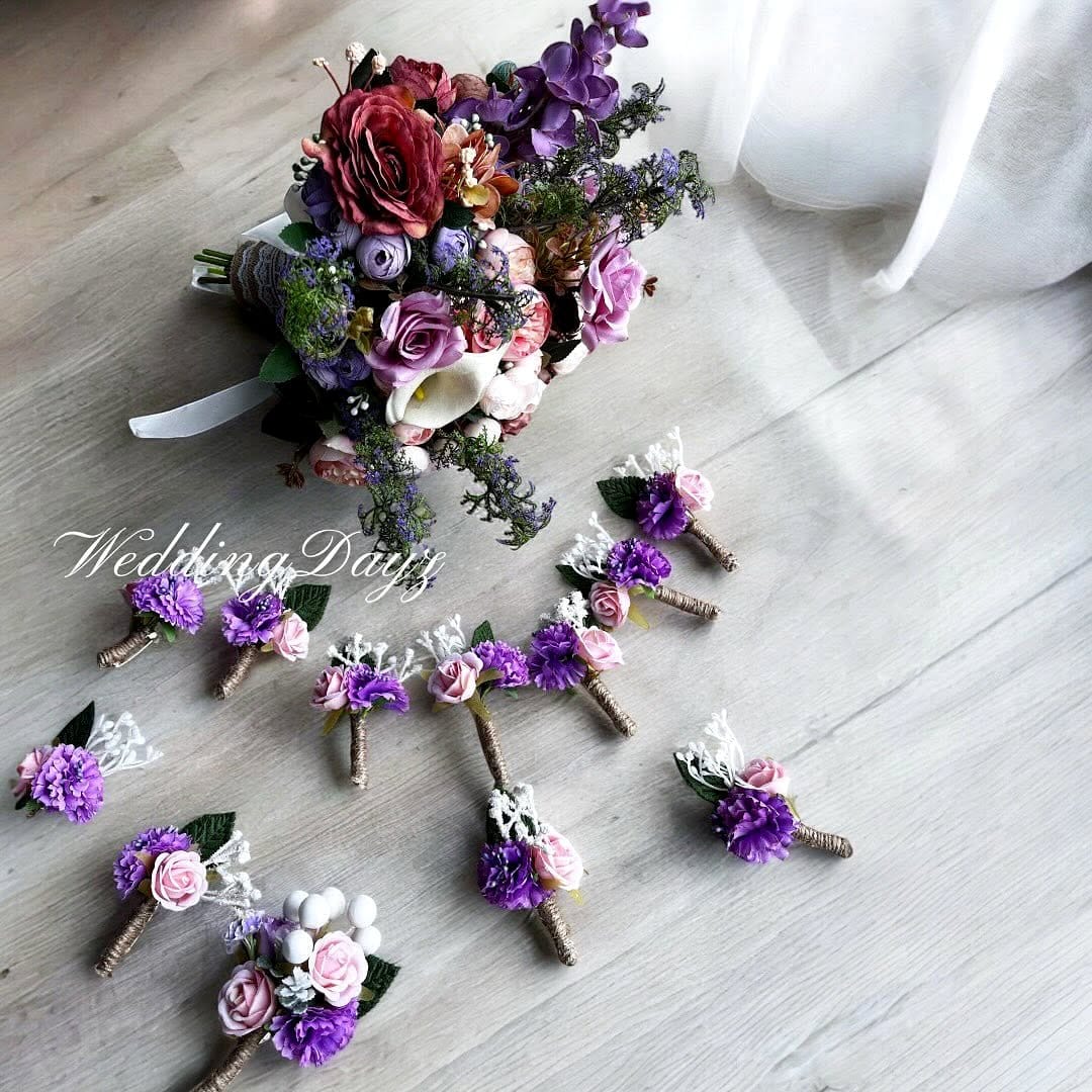 lavender boutonniere on suit