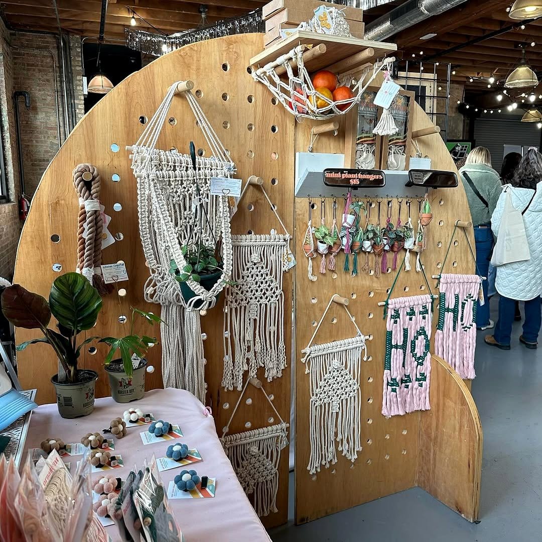 macramé hanger holding two pots