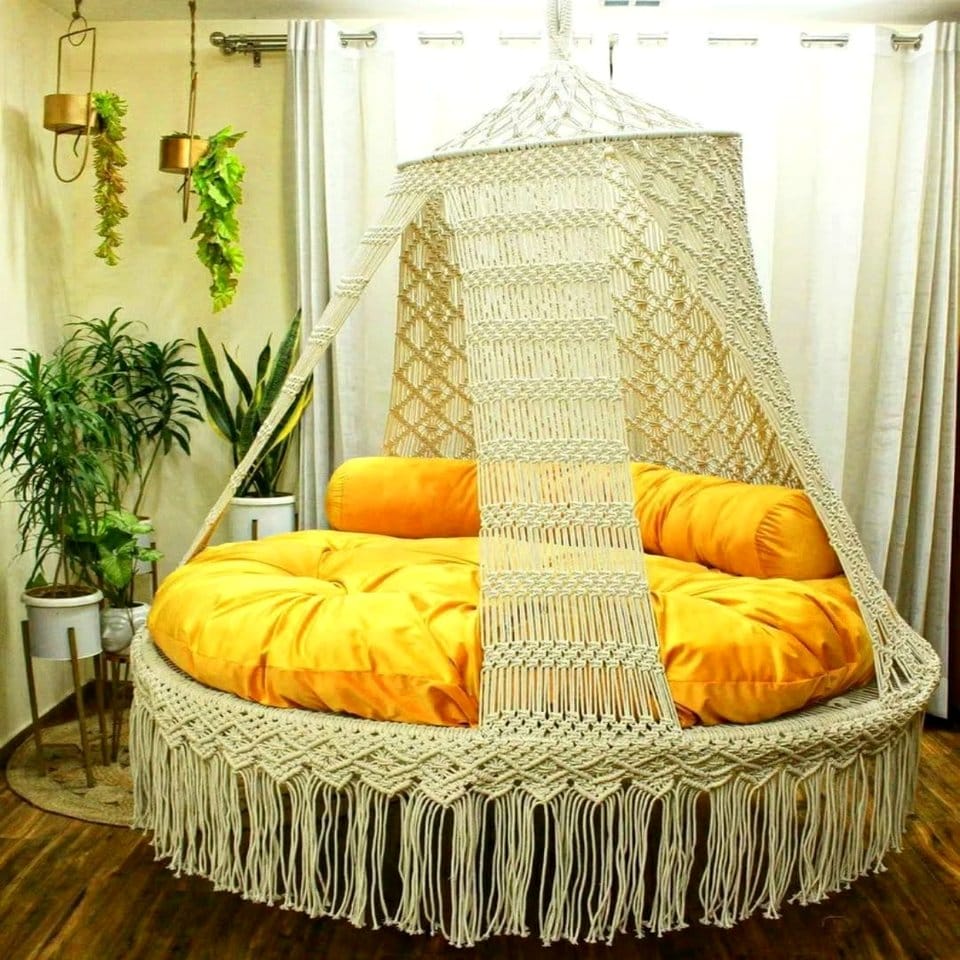 Bedroom canopy with macramé plant hangers