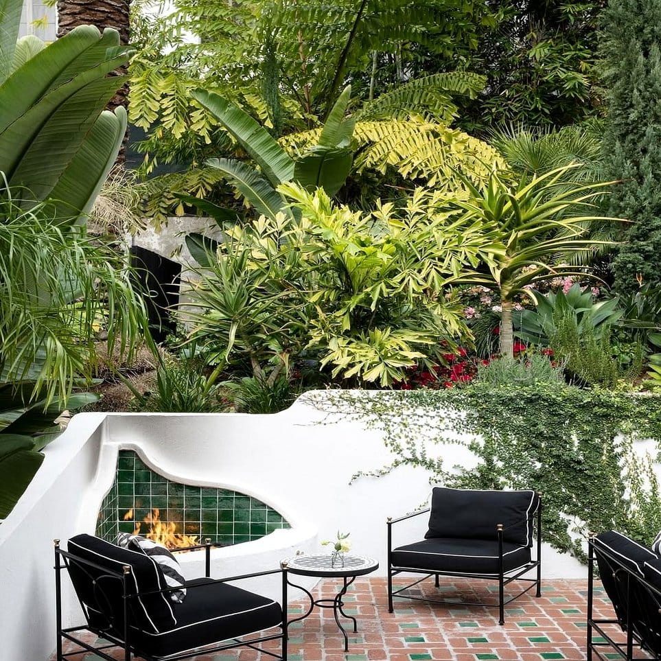 Velvet-covered ottoman with plant display