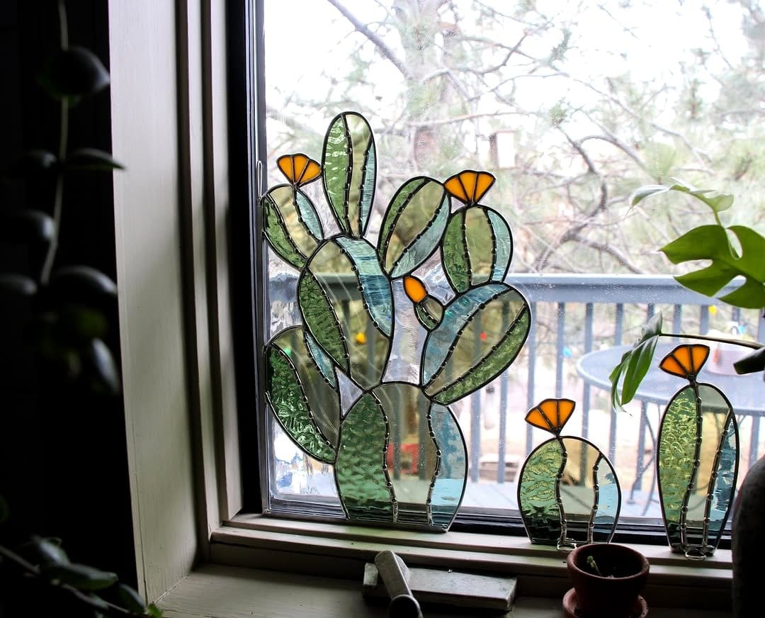 Stained glass picture frame with embedded leaves