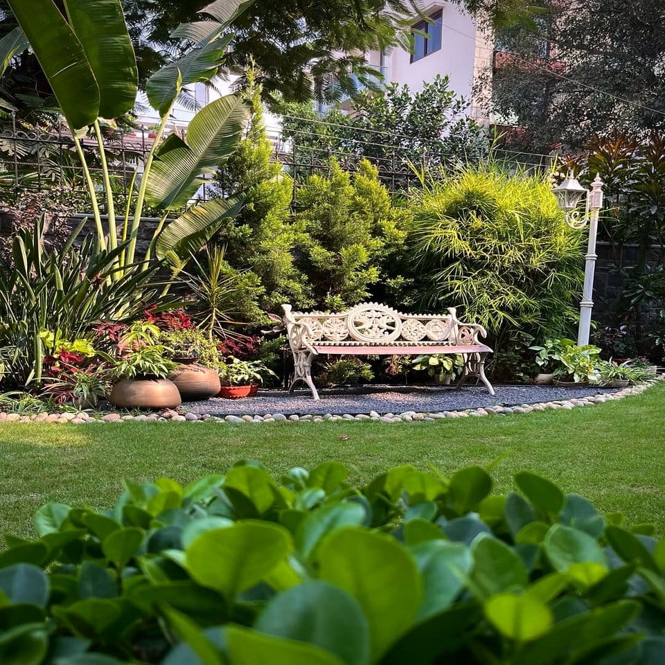 Rustic garden bench with water lily carvings
