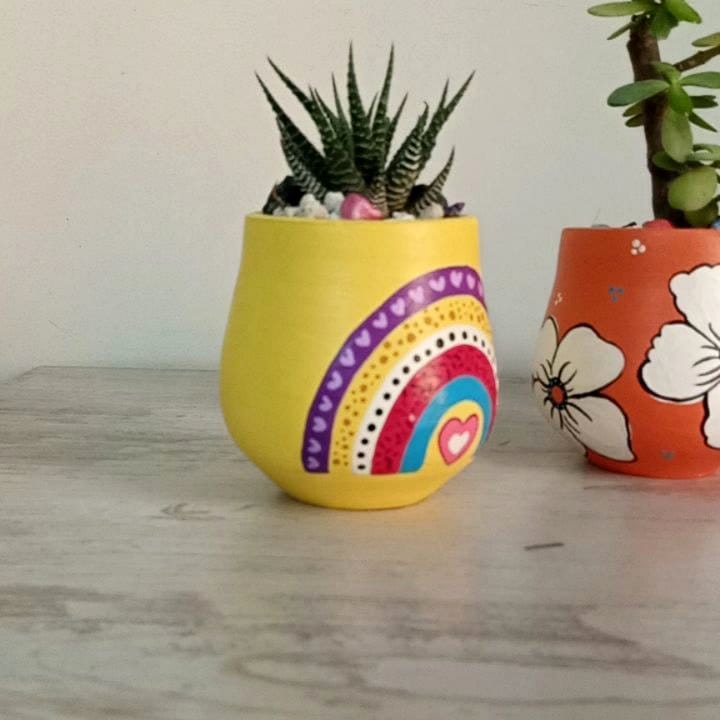 DIY inkblot plant pot with paint and brushes