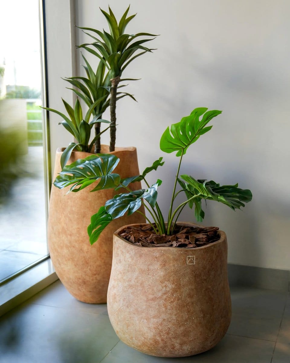 Earth-tone inkblot plant pots with natural patterns