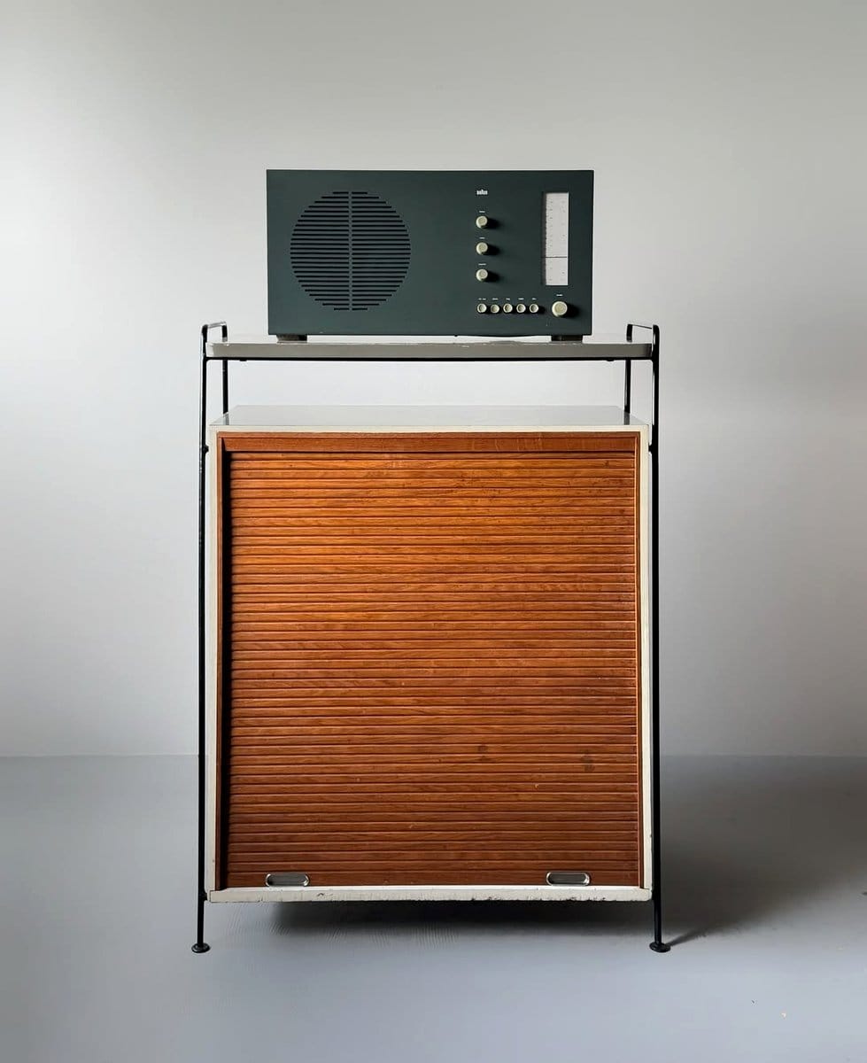 old radio as bookend on shelf