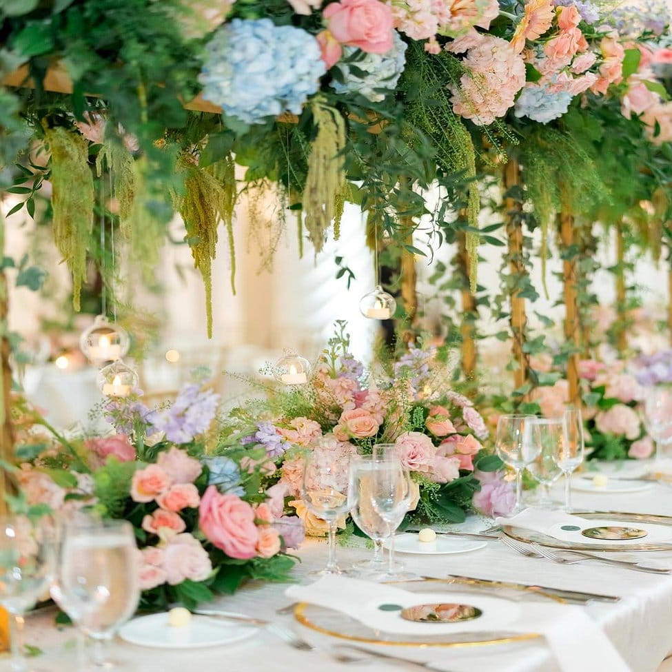 Wedding table with raindrop glass plant centerpieces