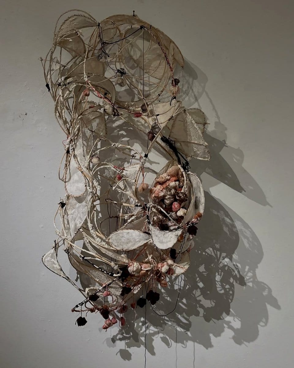 string art casting shadows on wall