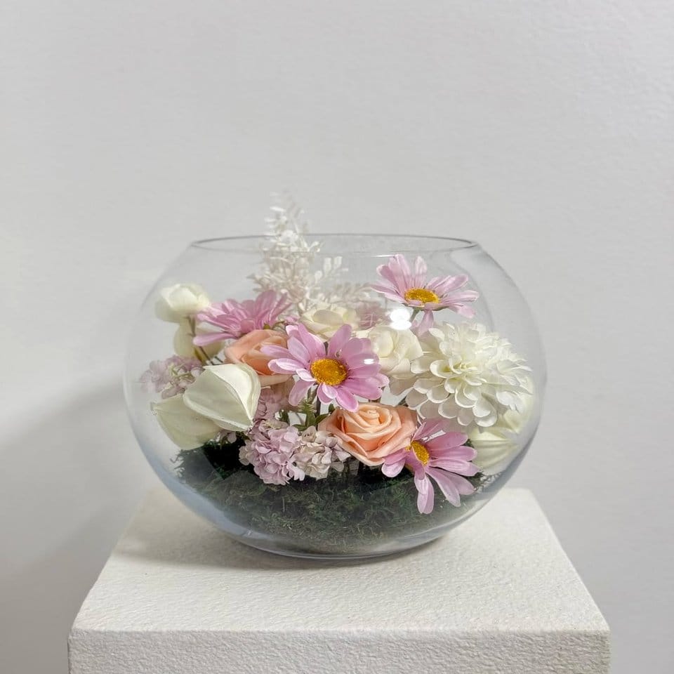 Glass bowl with floating cherry blossom petals