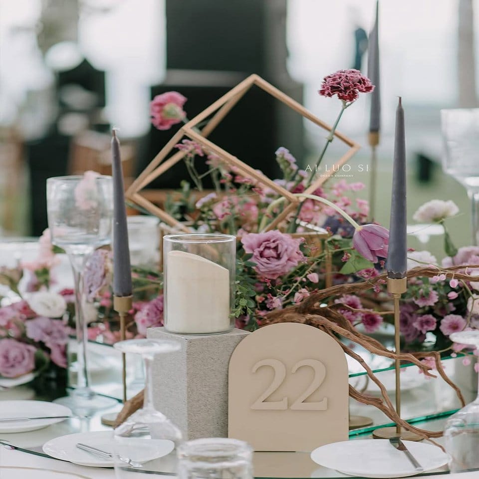 Glam rock-inspired plant centerpieces on a table