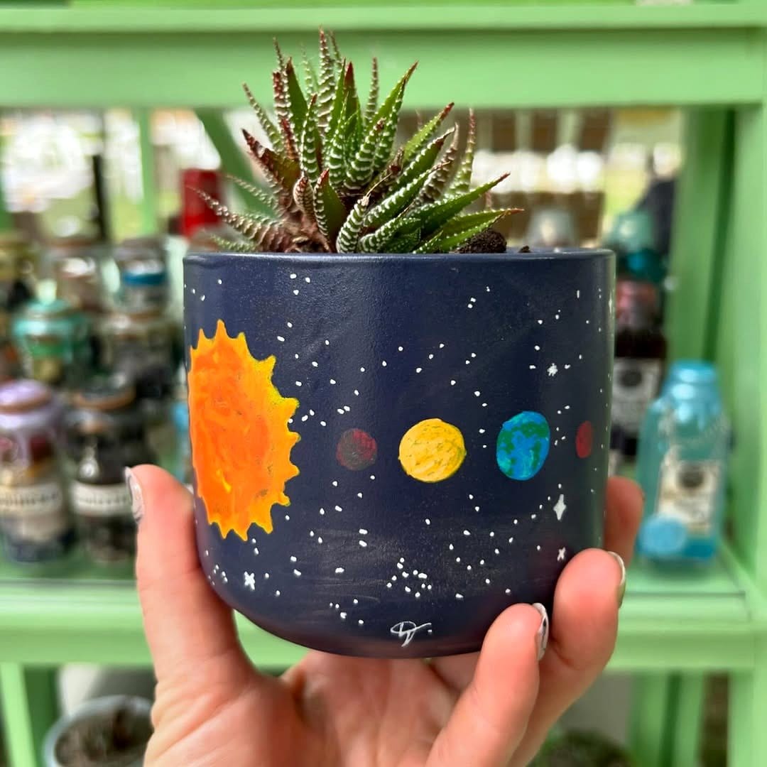 Watercolor effect plant pots with soft designs