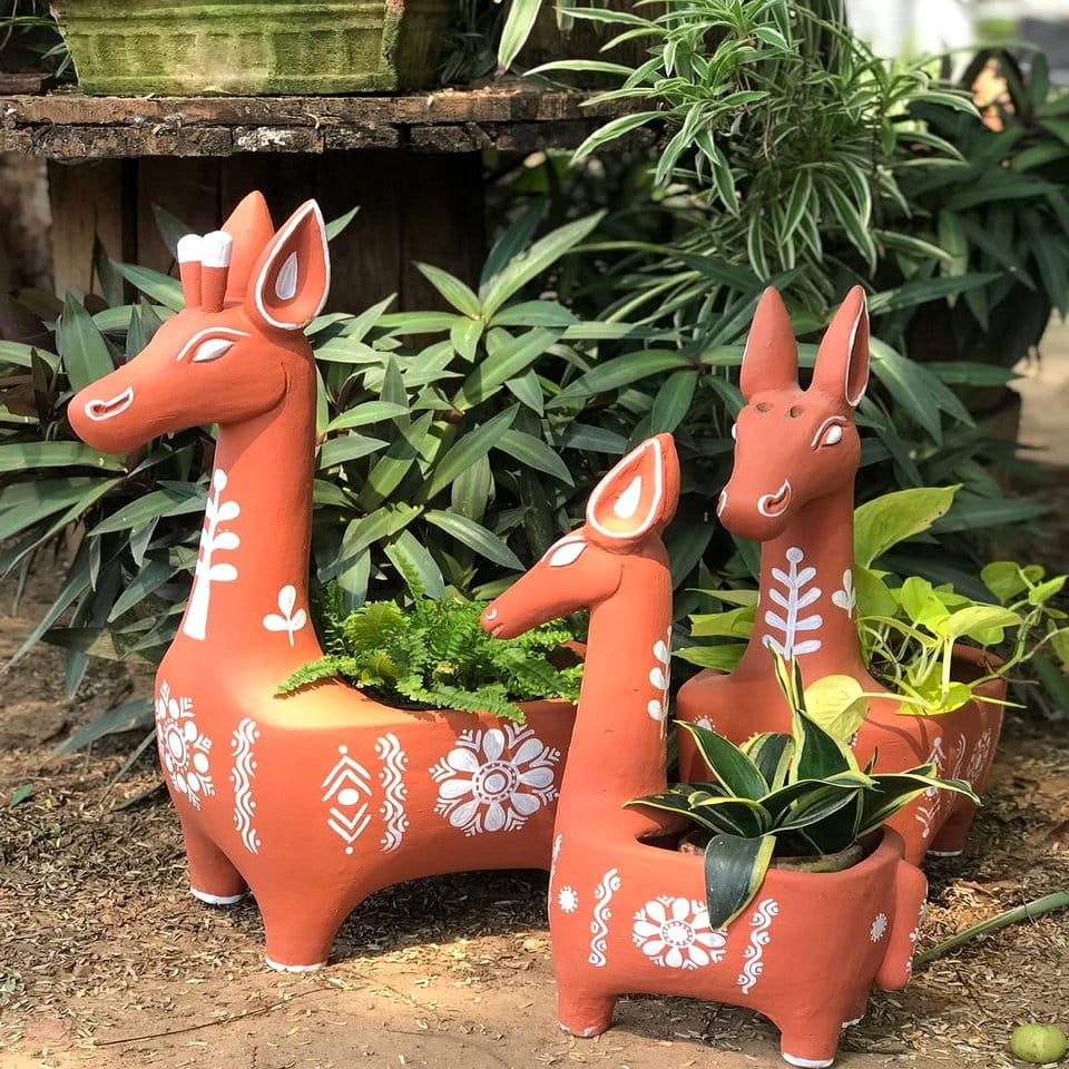 Animal-themed quilted plant pot cover with paw prints