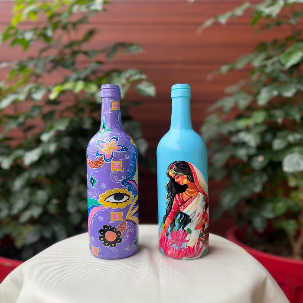 Recycled glass bottles with blue ombre paint