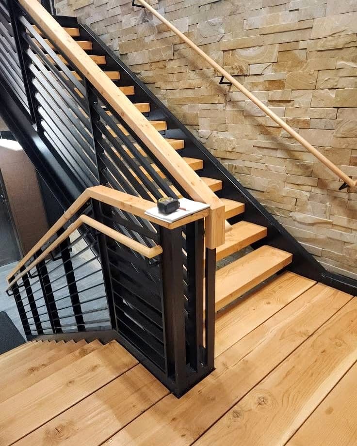 Rustic staircase with wooden steps and iron railings