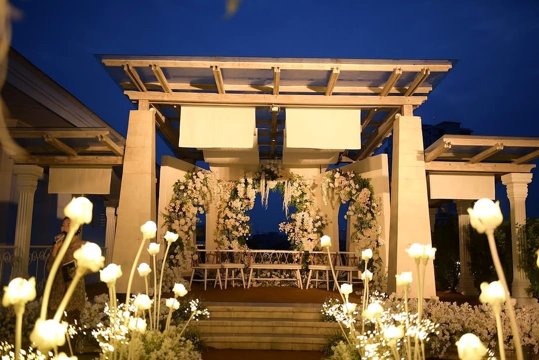 Elegant wedding setup with reflective plant hangers