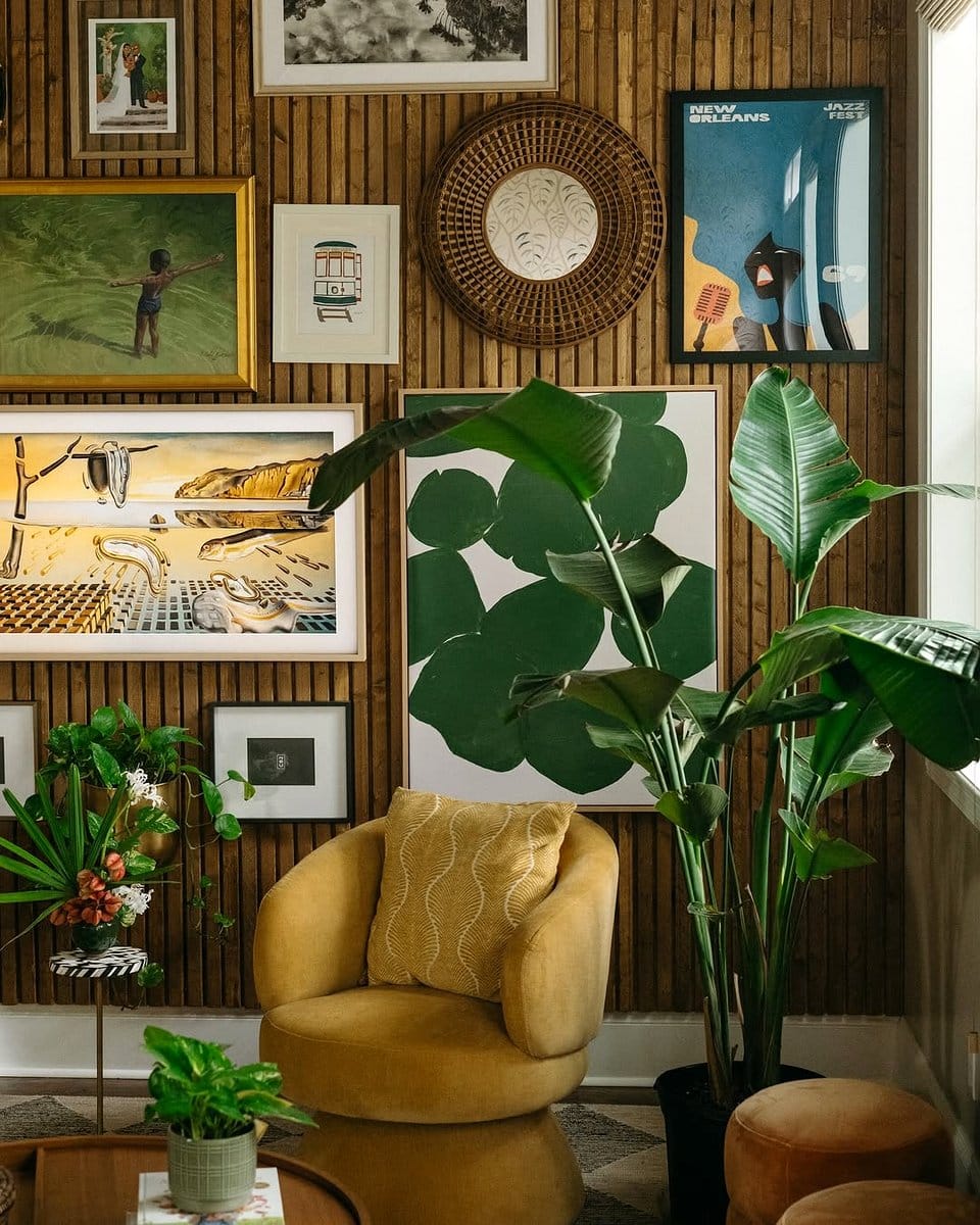 Art gallery-style room with petrified wood plant stand and colorful paintings