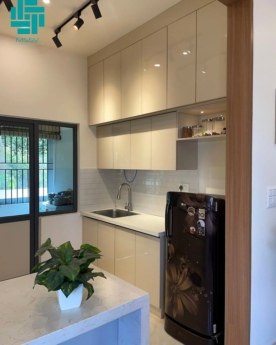 Organized minimalist galley kitchen with white cabinets