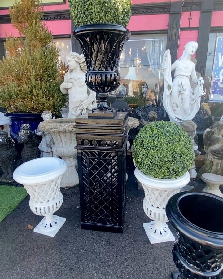 elegant metal urn with topiary