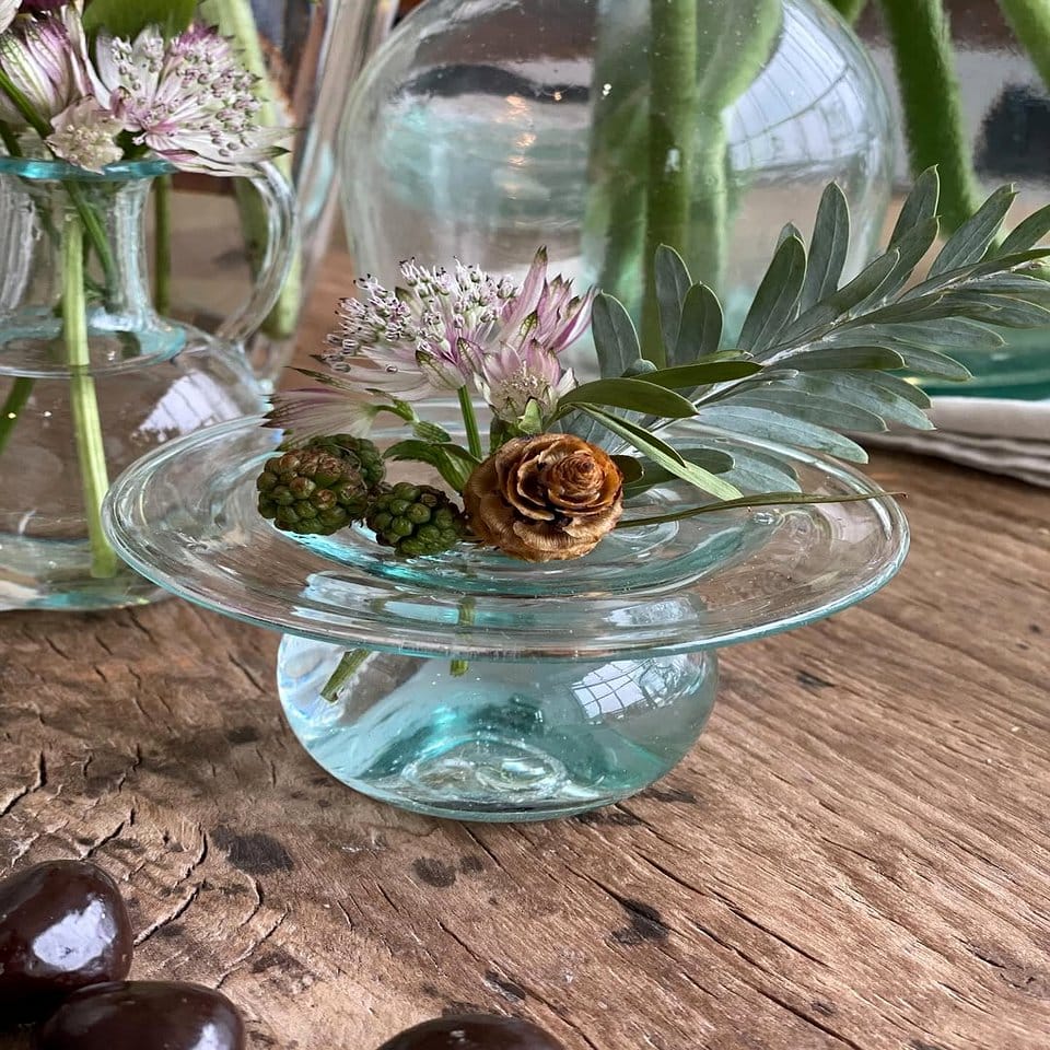 Candle holder with shells and succulents