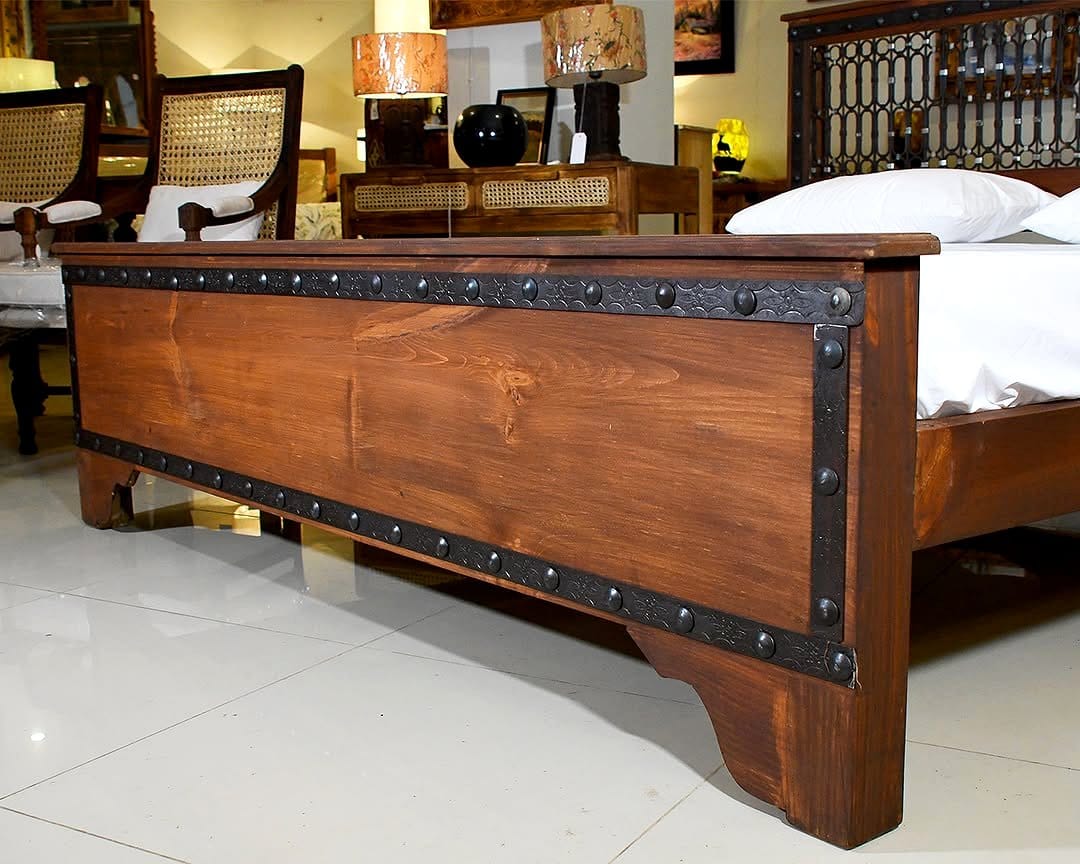 Wooden headboard with wrought iron detailing