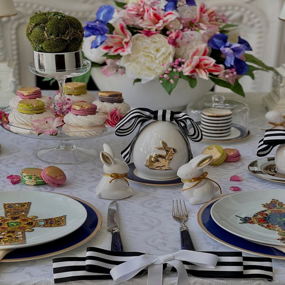 Elegant table setting with linen napkins and a plant centerpiece