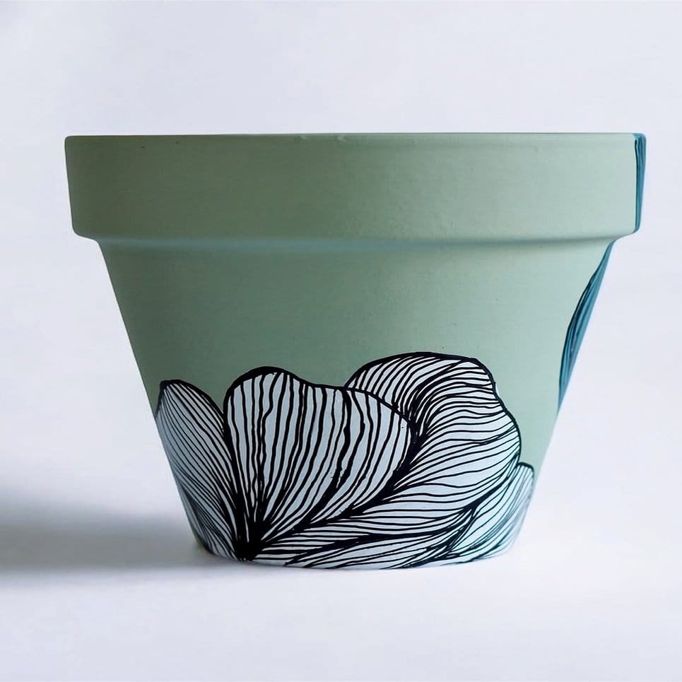 Geometric tribal design on a painted plant pot