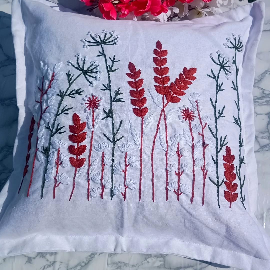 Decorative cushions with embroidered plant tattoo designs