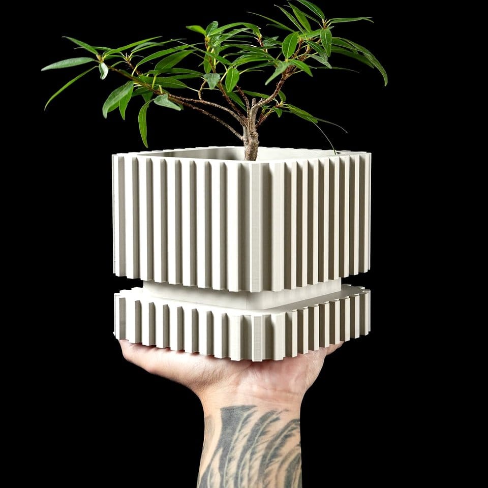 Retro 70s style painted plant pot with bold stripes