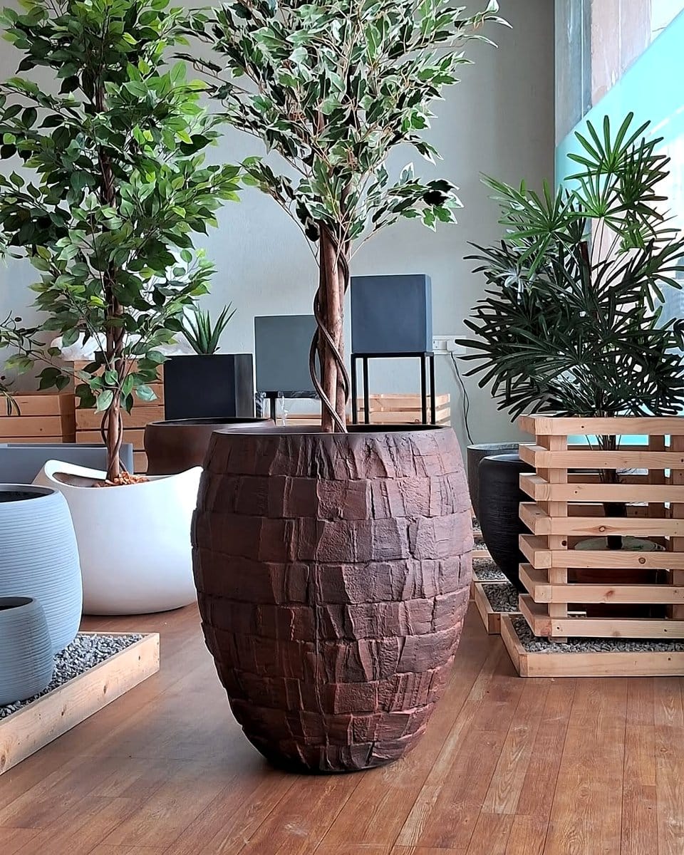 sleek cylinder fiberglass planters in living room